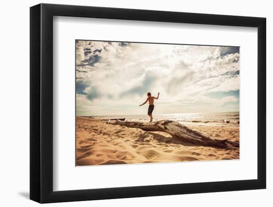 Boy Balancing on a Washed up Tree Trunk on the Beach-soupstock-Framed Photographic Print
