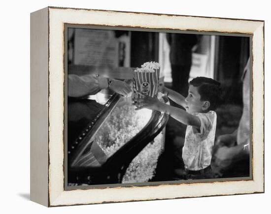 Boy Buying Popcorn at Movie Concession Stand-Peter Stackpole-Framed Premier Image Canvas