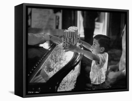 Boy Buying Popcorn at Movie Concession Stand-Peter Stackpole-Framed Premier Image Canvas