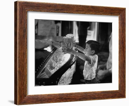 Boy Buying Popcorn at Movie Concession Stand-Peter Stackpole-Framed Photographic Print