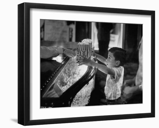 Boy Buying Popcorn at Movie Concession Stand-Peter Stackpole-Framed Photographic Print