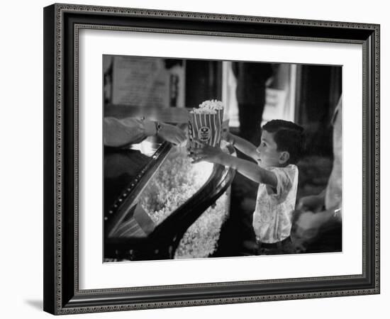 Boy Buying Popcorn at Movie Concession Stand-Peter Stackpole-Framed Photographic Print