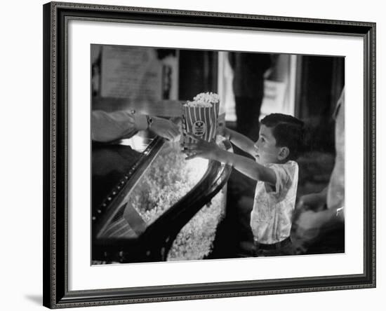 Boy Buying Popcorn at Movie Concession Stand-Peter Stackpole-Framed Photographic Print