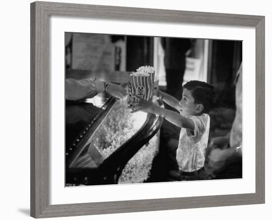 Boy Buying Popcorn at Movie Concession Stand-Peter Stackpole-Framed Photographic Print