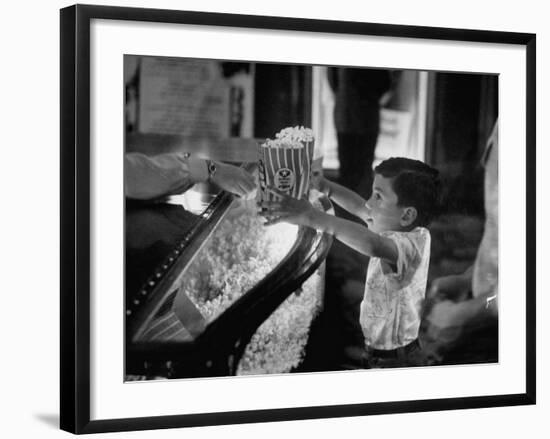 Boy Buying Popcorn at Movie Concession Stand-Peter Stackpole-Framed Photographic Print