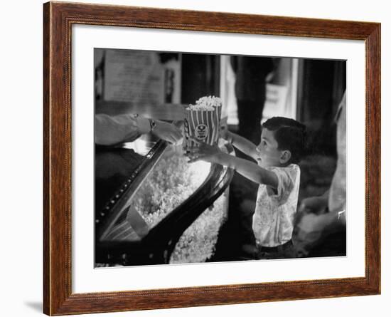 Boy Buying Popcorn at Movie Concession Stand-Peter Stackpole-Framed Photographic Print