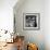 Boy Combining Play and Seasonal Chore, Stirring a Pile of Burning Leaves-Allan Grant-Framed Photographic Print displayed on a wall