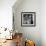 Boy Combining Play and Seasonal Chore, Stirring a Pile of Burning Leaves-Allan Grant-Framed Photographic Print displayed on a wall