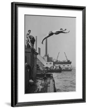 Boy Diving from Top of Building on Wharf, Poised in Air over River-null-Framed Photographic Print