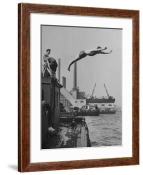 Boy Diving from Top of Building on Wharf, Poised in Air over River-null-Framed Photographic Print