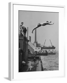 Boy Diving from Top of Building on Wharf, Poised in Air over River-null-Framed Photographic Print