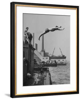Boy Diving from Top of Building on Wharf, Poised in Air over River-null-Framed Photographic Print