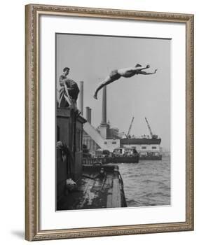 Boy Diving from Top of Building on Wharf, Poised in Air over River-null-Framed Photographic Print