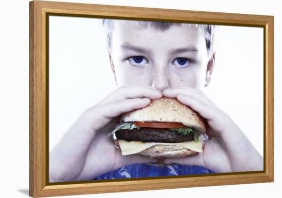 Boy Eating a Burger-Kevin Curtis-Framed Premier Image Canvas