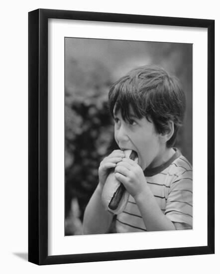 Boy Eating Hot Dog-Ralph Morse-Framed Photographic Print