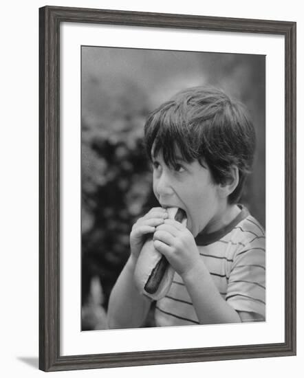 Boy Eating Hot Dog-Ralph Morse-Framed Photographic Print