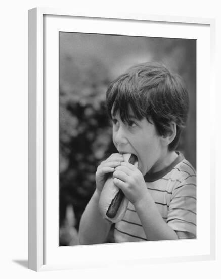 Boy Eating Hot Dog-Ralph Morse-Framed Photographic Print