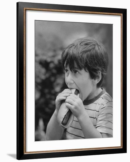 Boy Eating Hot Dog-Ralph Morse-Framed Photographic Print