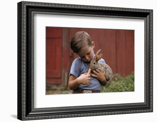 Boy Feeding a Rabbit-William P. Gottlieb-Framed Photographic Print