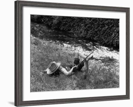 Boy Fishing with Hat Over Face-Bettmann-Framed Photographic Print