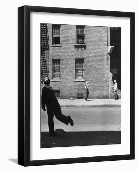Boy Hitting Ball During Game of Stickball-Ralph Morse-Framed Photographic Print