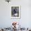 Boy in an Oversized Football Uniform Holding a Helmet-null-Framed Photographic Print displayed on a wall