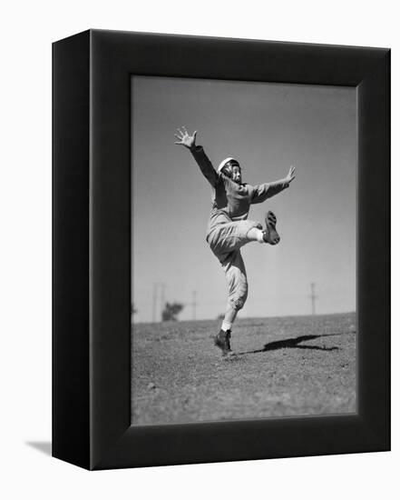 Boy Kicking a Football-Bettmann-Framed Premier Image Canvas