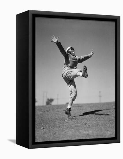 Boy Kicking a Football-Bettmann-Framed Premier Image Canvas