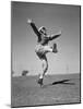 Boy Kicking a Football-Bettmann-Mounted Photographic Print