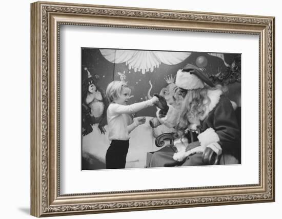 Boy Kissing African American Santa Claus in Unidentified Department Store. 1970-Ralph Morse-Framed Photographic Print