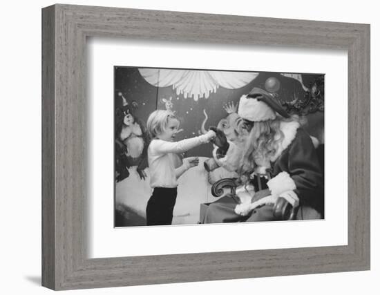 Boy Kissing African American Santa Claus in Unidentified Department Store. 1970-Ralph Morse-Framed Photographic Print