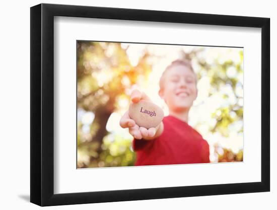 Boy Laughing and Holding a Stone with the Word Laugh. Instagram Effect-soupstock-Framed Photographic Print