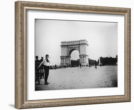 Boy on Bike as Hundreds Ride Bikes Through the Arch at Prospect Park During a Bicycle Parade-Wallace G^ Levison-Framed Photographic Print