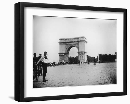 Boy on Bike as Hundreds Ride Bikes Through the Arch at Prospect Park During a Bicycle Parade-Wallace G^ Levison-Framed Photographic Print