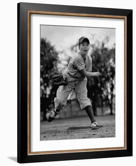 Boy Playing a Game of Little League Baseball-Yale Joel-Framed Photographic Print