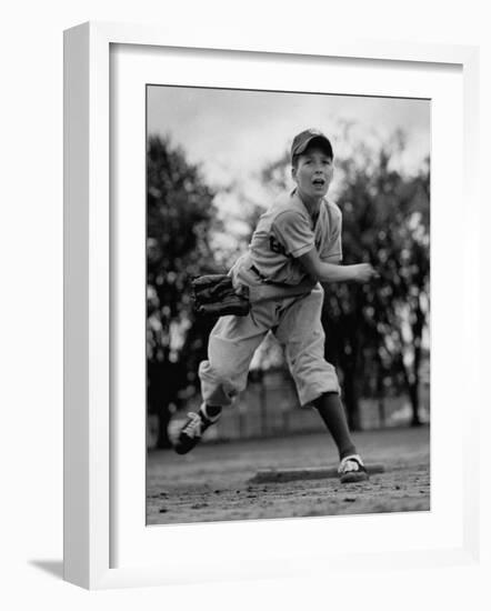 Boy Playing a Game of Little League Baseball-Yale Joel-Framed Photographic Print