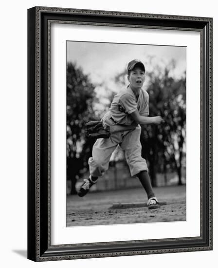 Boy Playing a Game of Little League Baseball-Yale Joel-Framed Photographic Print