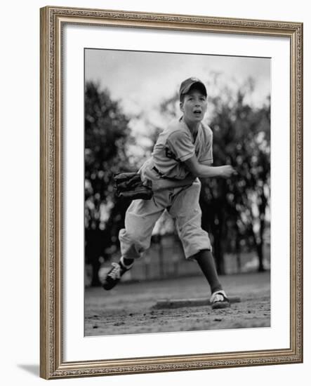 Boy Playing a Game of Little League Baseball-Yale Joel-Framed Photographic Print