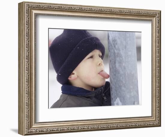 Boy Putting Tongue to Frozen Pole-Dann Tardif-Framed Photographic Print