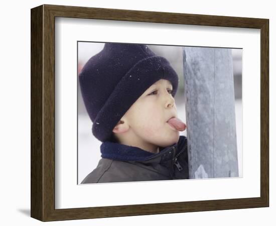 Boy Putting Tongue to Frozen Pole-Dann Tardif-Framed Photographic Print