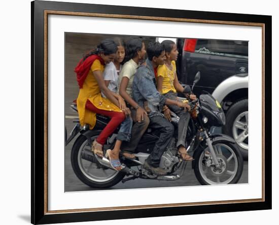 Boy Rides a Motorbike with Four Girls, as it Drizzles in Hyderabad, India-null-Framed Photographic Print