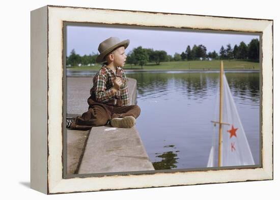 Boy Sitting by Lake in Cowboy Hat-William P. Gottlieb-Framed Premier Image Canvas