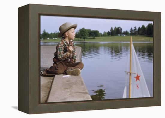 Boy Sitting by Lake in Cowboy Hat-William P. Gottlieb-Framed Premier Image Canvas