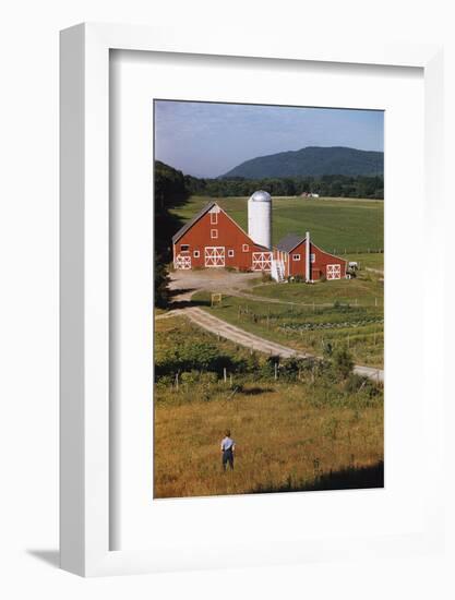 Boy Standing in Field Near Red Barn-William P. Gottlieb-Framed Photographic Print