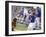 Boy Swinging a Baseball Bat on a Field-null-Framed Photographic Print