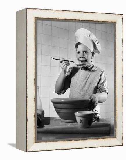 Boy Tasting His Cooking-Philip Gendreau-Framed Premier Image Canvas