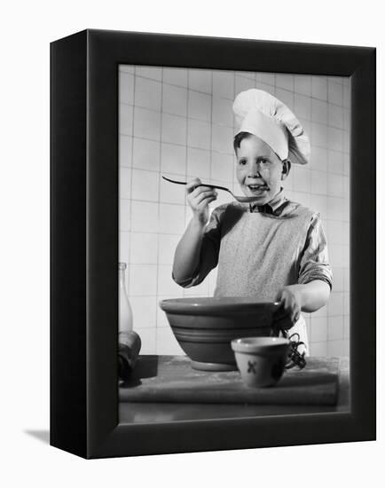 Boy Tasting His Cooking-Philip Gendreau-Framed Premier Image Canvas