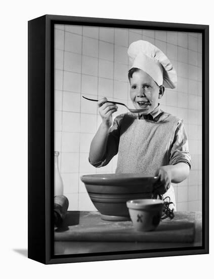 Boy Tasting His Cooking-Philip Gendreau-Framed Premier Image Canvas