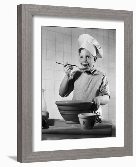 Boy Tasting His Cooking-Philip Gendreau-Framed Photographic Print