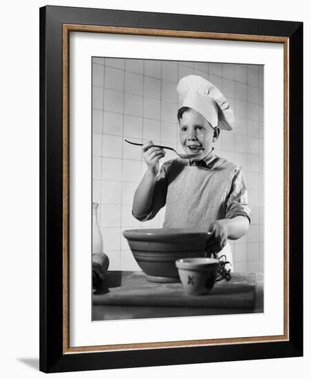 Boy Tasting His Cooking-Philip Gendreau-Framed Photographic Print